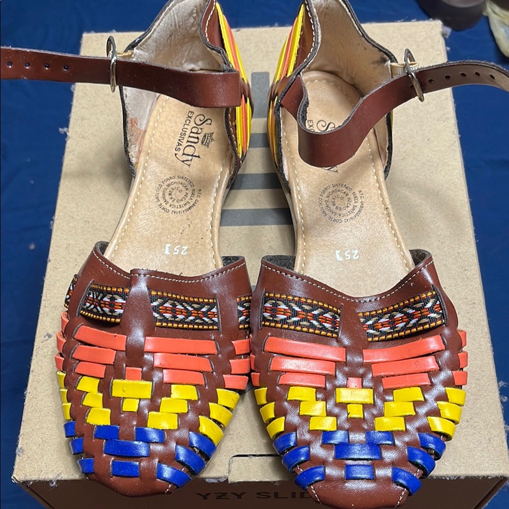 Vibrant Red and Yellow Sandals with Intricate Woven Design